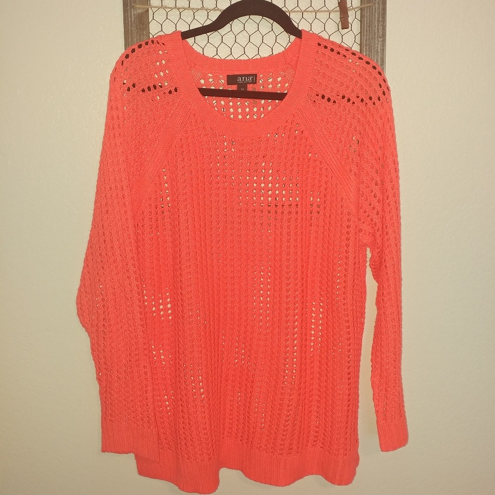 Neon orange long sleeve sweater.